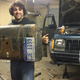 Philip holds the gas tank skid plate. He’s proud of his rust-hole patch job.